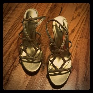 Gold, ankle strap heels.